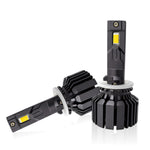 Two black car headlight bulbs